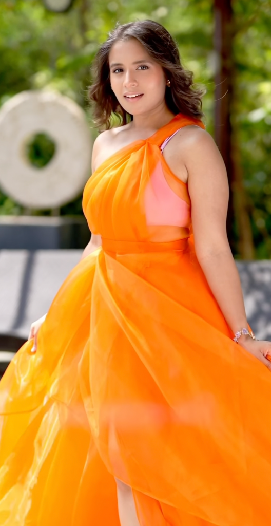 Aishwarya Majmudar portrait in an elegant orange dress